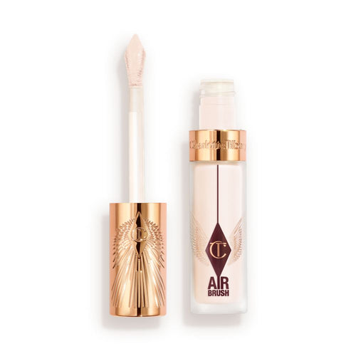 Charlotte Tilbury Airbrush Flawless Concealer with rose-gold cap and doe-foot applicator, shown with the lid off and product visible in a frosted tube.