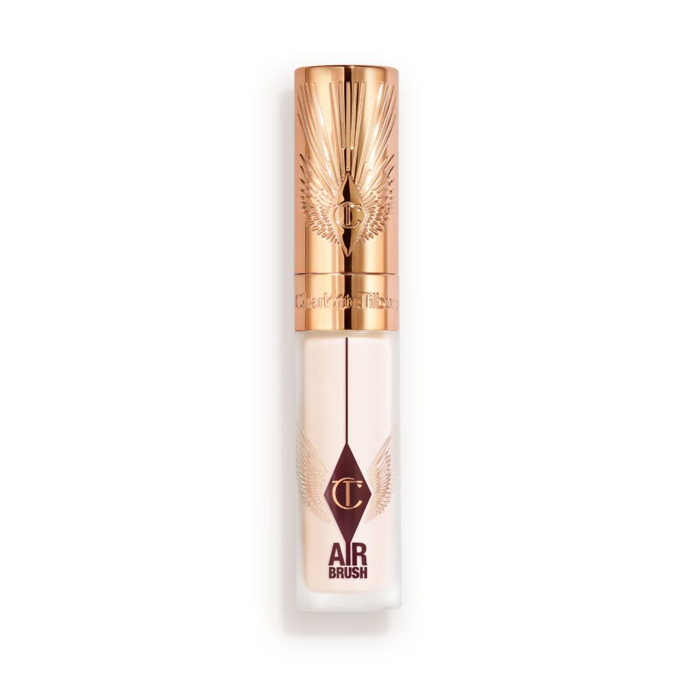 Charlotte Tilbury Airbrush Flawless Concealer in a frosted tube with rose-gold cap and winged design, displayed upright with lid closed.