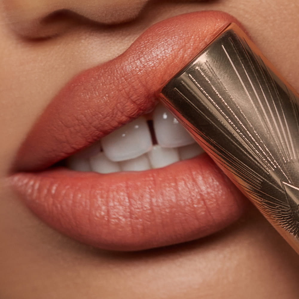 Airbrush Flawless Lip Blur in Honey close up on medium skin tone model
