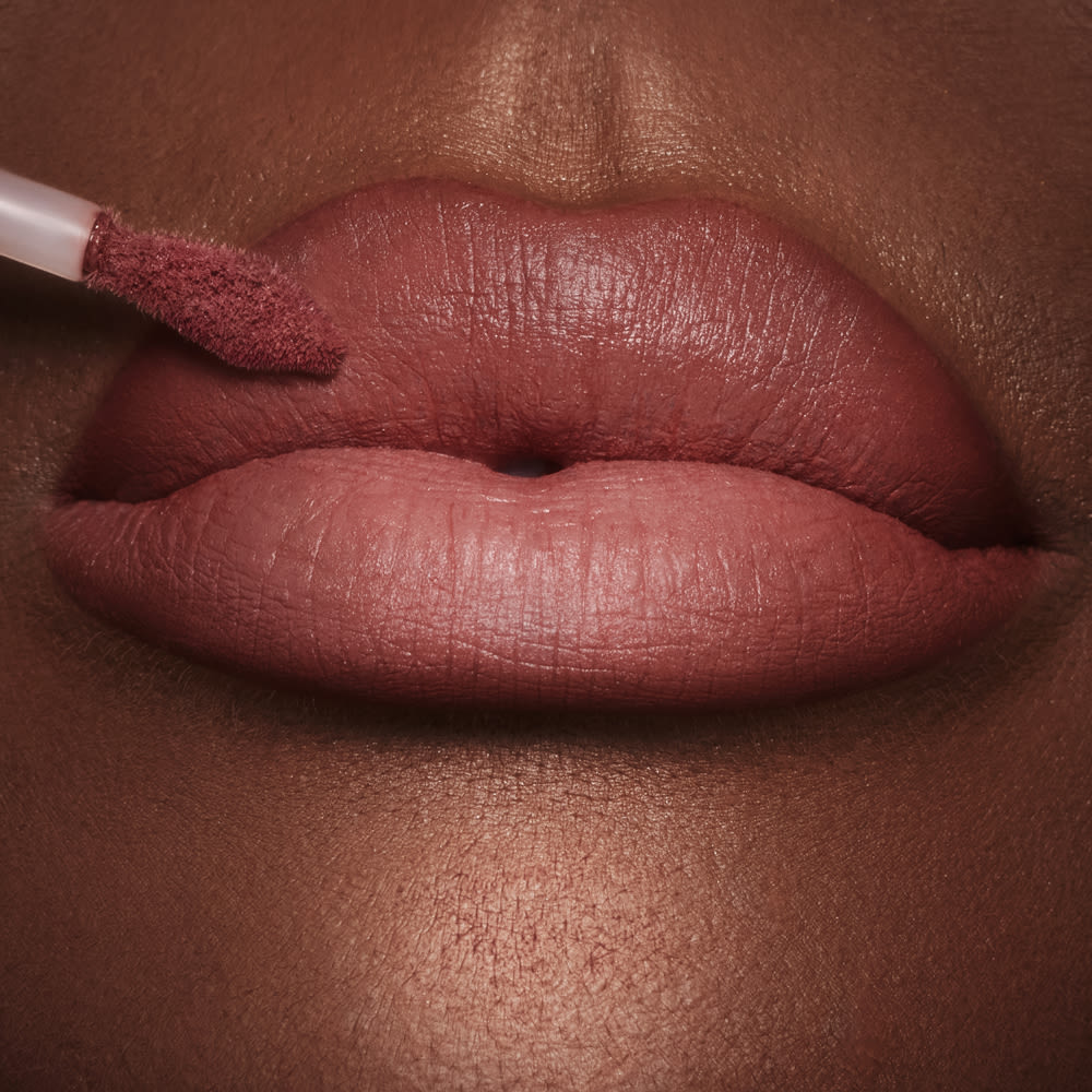 Pillow Talk Medium Airbrush Lip Blur close up on a deep skin tone model