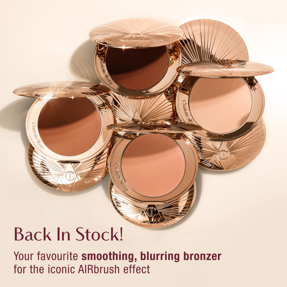 Five open compacts of Charlotte Tilbury bronzer with rose gold packaging, arranged in a circular pattern. Text reads 'Back In Stock! Your favourite smoothing, blurring bronzer for the iconic AIRbrush effect.