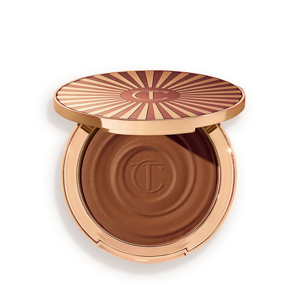 Open, cream bronzer compact in a dark-brown shade with gold-coloured packaging.