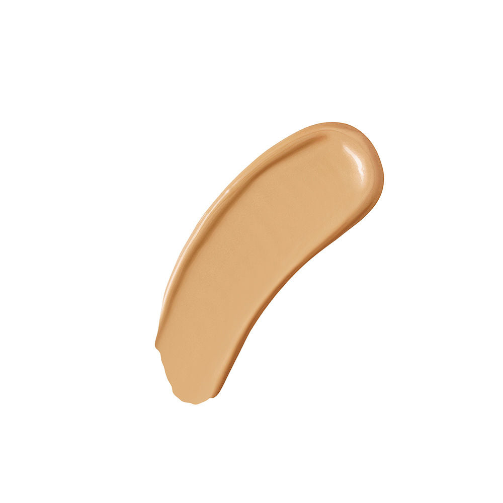 Swatch of a creamy, liquid foundation in a sandy brown shade.
