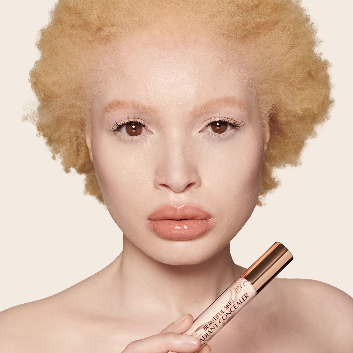 Fair-tone model wearing a radiant, skin-like concealer that covers her freckles, wrinkles, and dark circles, and makes her look fresh and youthful.