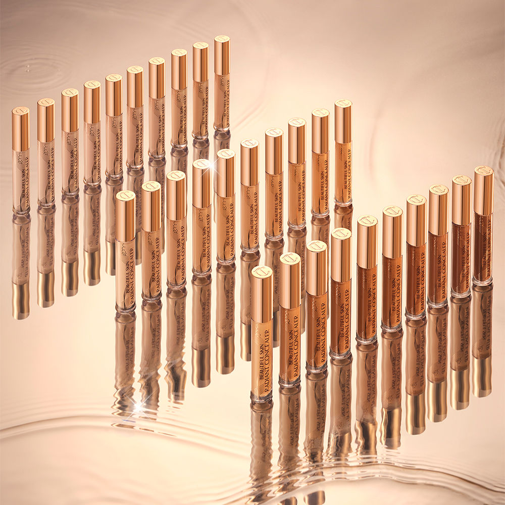 A collection of creamy concealers with a radiant, glowy finish in glass tubes with gold-coloured lids for skin tones of all types.