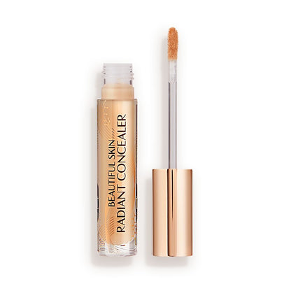 Radiant concealer in a glass tube with its doe-foot applicator next to it with a gold-coloured handle.