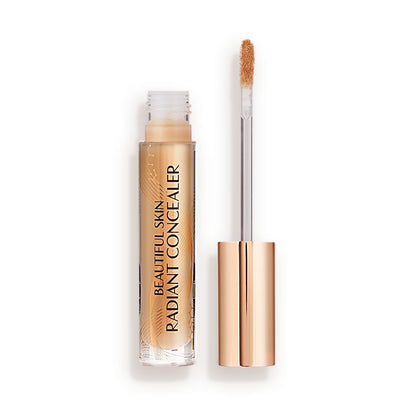 Radiant concealer in a glass tube with its doe-foot applicator next to it with a gold-coloured handle.