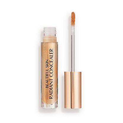 Radiant concealer in a glass tube with its doe-foot applicator next to it with a gold-coloured handle.