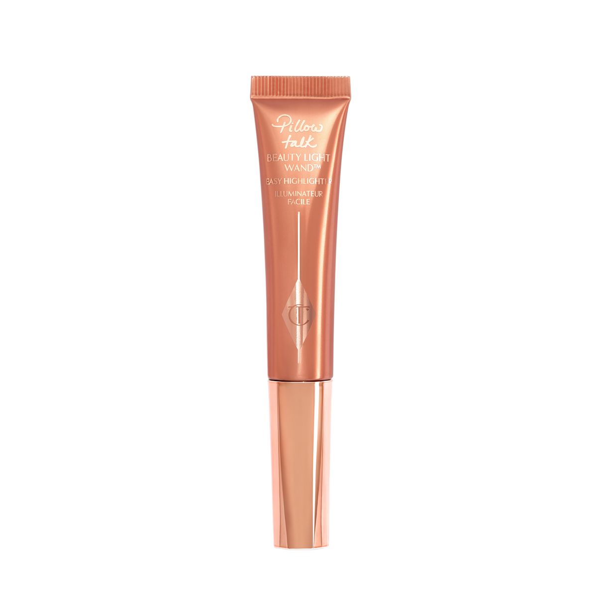 A liquid highlighter wand in a coppery-gold plastic tube with its nude-pink box next to it.