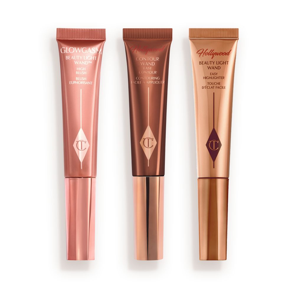 Medium-pink liquid blush wand, glowy brown contour wand, and soft candlelight-gold-coloured liquid highlighter wand.