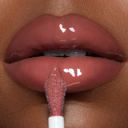 Pillow Talk Big Lip Plumpgasm - Medium/Deep on deep skin tone model