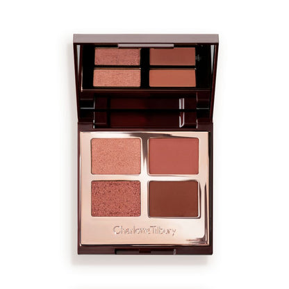 An open quad eyeshadow palette with metallic and matte shades of pearlescent rose gold, dusky rose, berry brown and rose-bud pink.