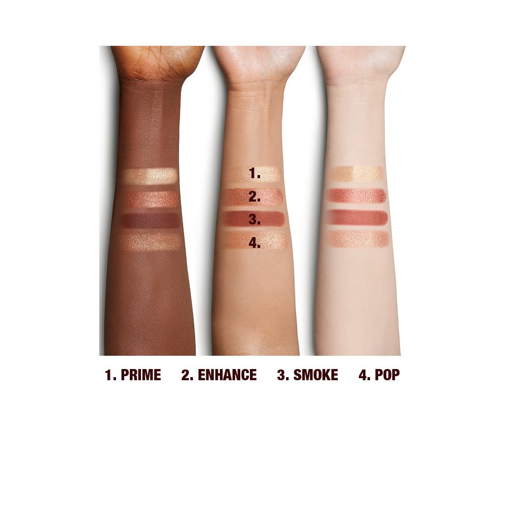 Deep, tan, and fair skin arm swatches of four matte and shimmery eyeshadows in shades of copper and champagne.