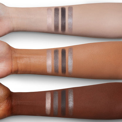 Four eyeshadow swatches in shades of grey, pearl, and silver on light, medium, and deep-tone arms.