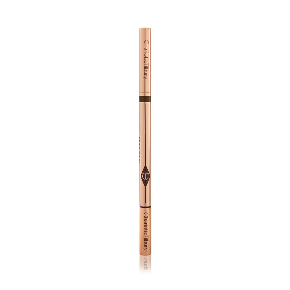 A closed, double-ended eyebrow pencil and spoolie brush duo with gold-coloured packaging.