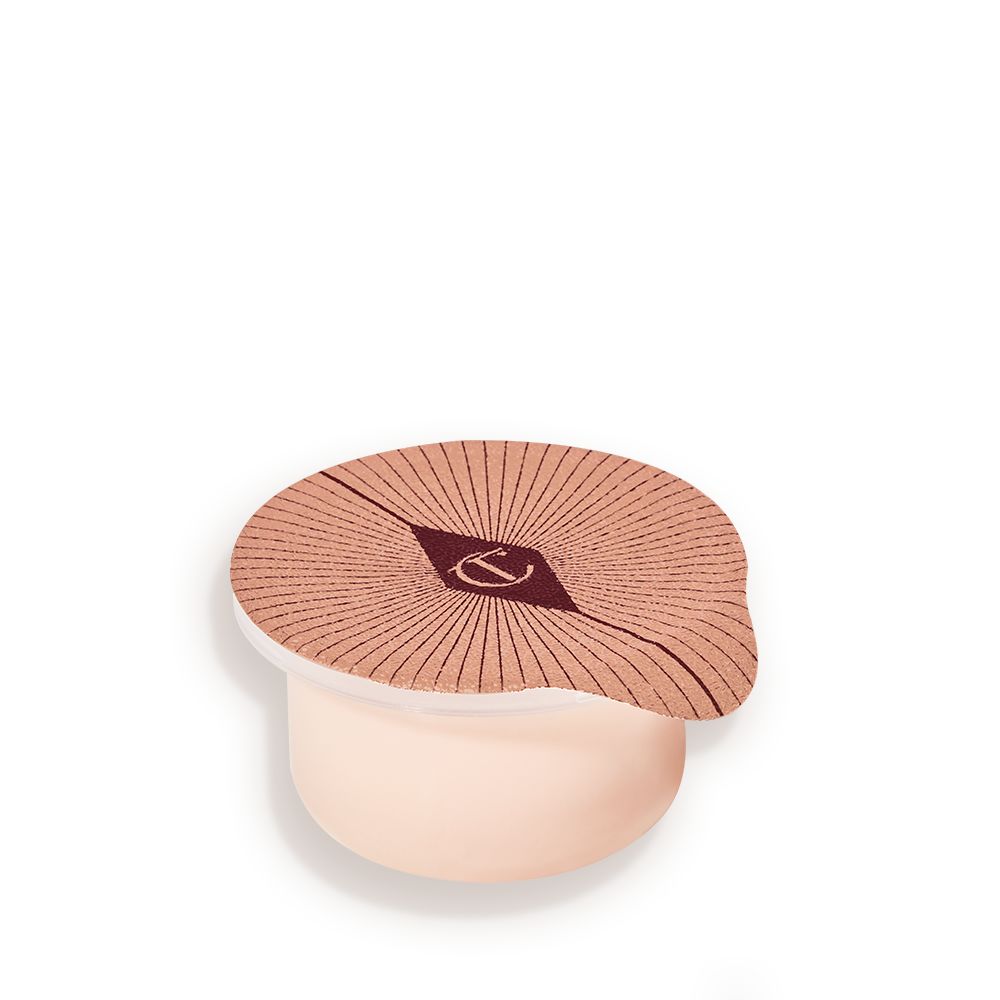 Refill of a champagne-coloured, thick and luscious eye cream in a petite pot with an easy-to-peel-off cover.