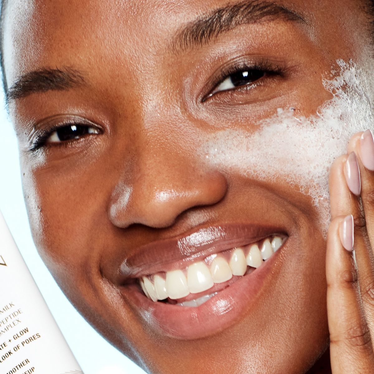 Model applying Charlotte's Magic Hydration Revival Cleanser