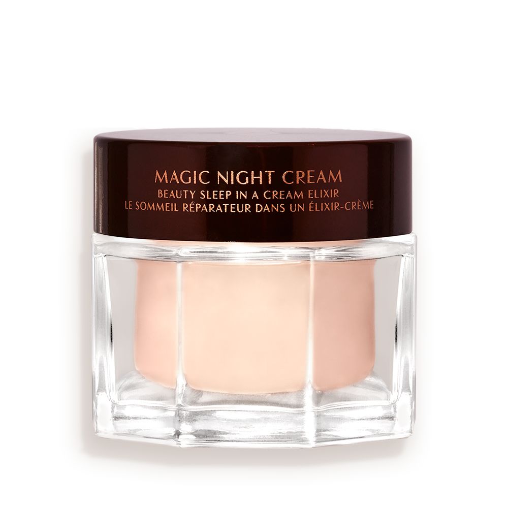 Award-wining, peach-coloured night cream in a large glass jar with a dark brown-coloured lid with Magic Night Cream written on it in gold colour.