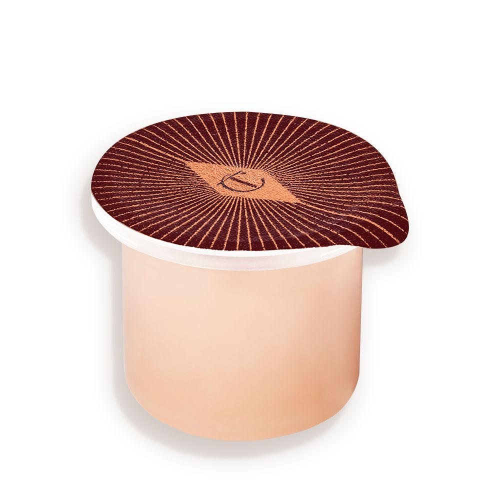 Refill of a peach-coloured, thick and luscious night cream in a pot with an easy-to-peel-off cover.