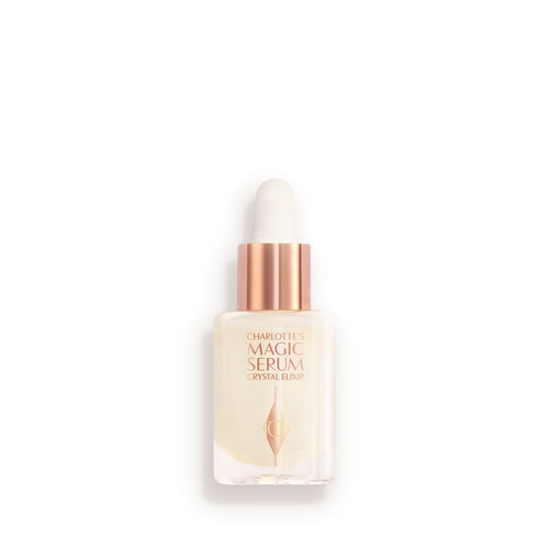 A travel-size, pearlescent serum in a glass bottle with a white rose gold coloured dropper lid.
