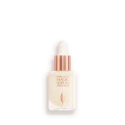 A luminous, ivory-coloured facial serum in a glass bottle with a white and gold-coloured dropper lid
