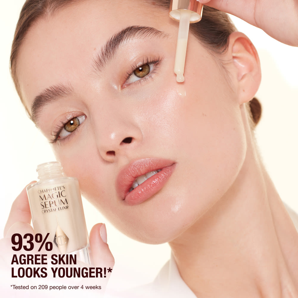 Model applying Charlottes Magic Crystal Elixir