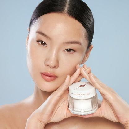 Fair skin tone model holding Magic Water Cream
