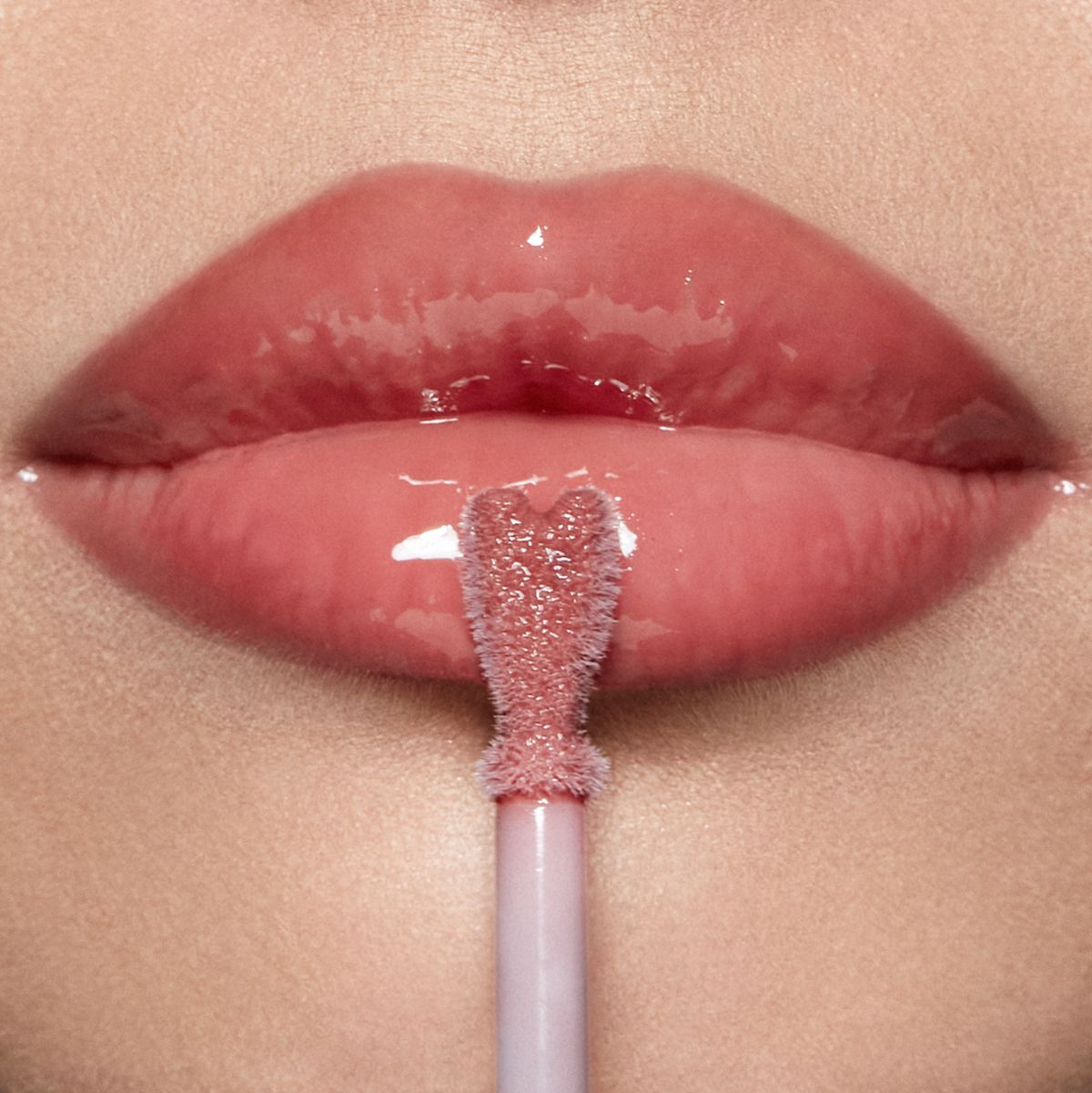 Collagen Lip Bath - Pillow Talk Medium on fair skin tone model