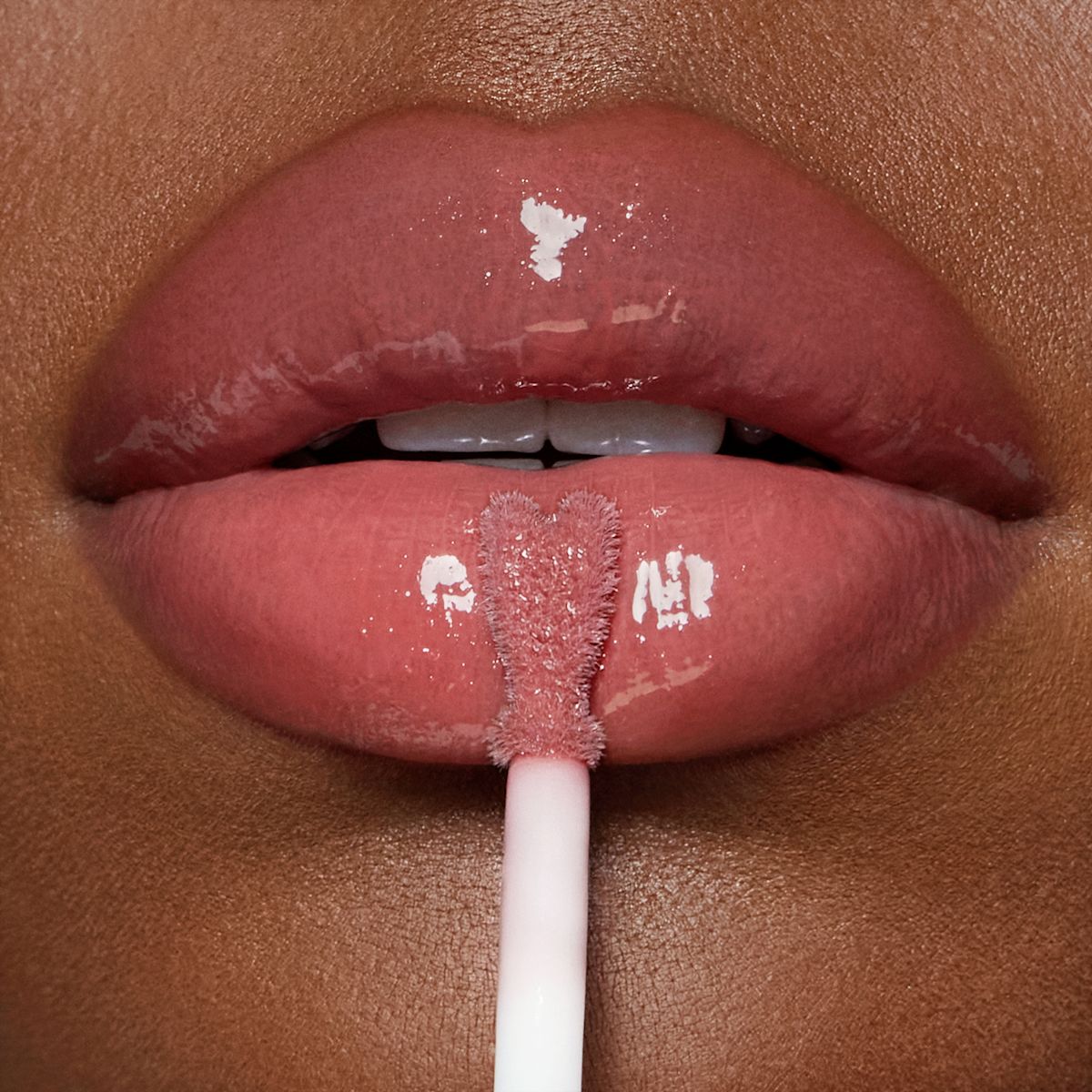 Collagen Lip Bath - Pillow Talk Medium on deep skin tone model
