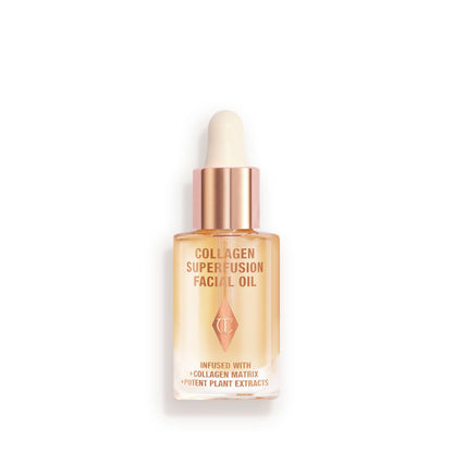 Travel-size light-gold-coloured facial oil in a glass bottle with a gold and white-coloured dropper lid.