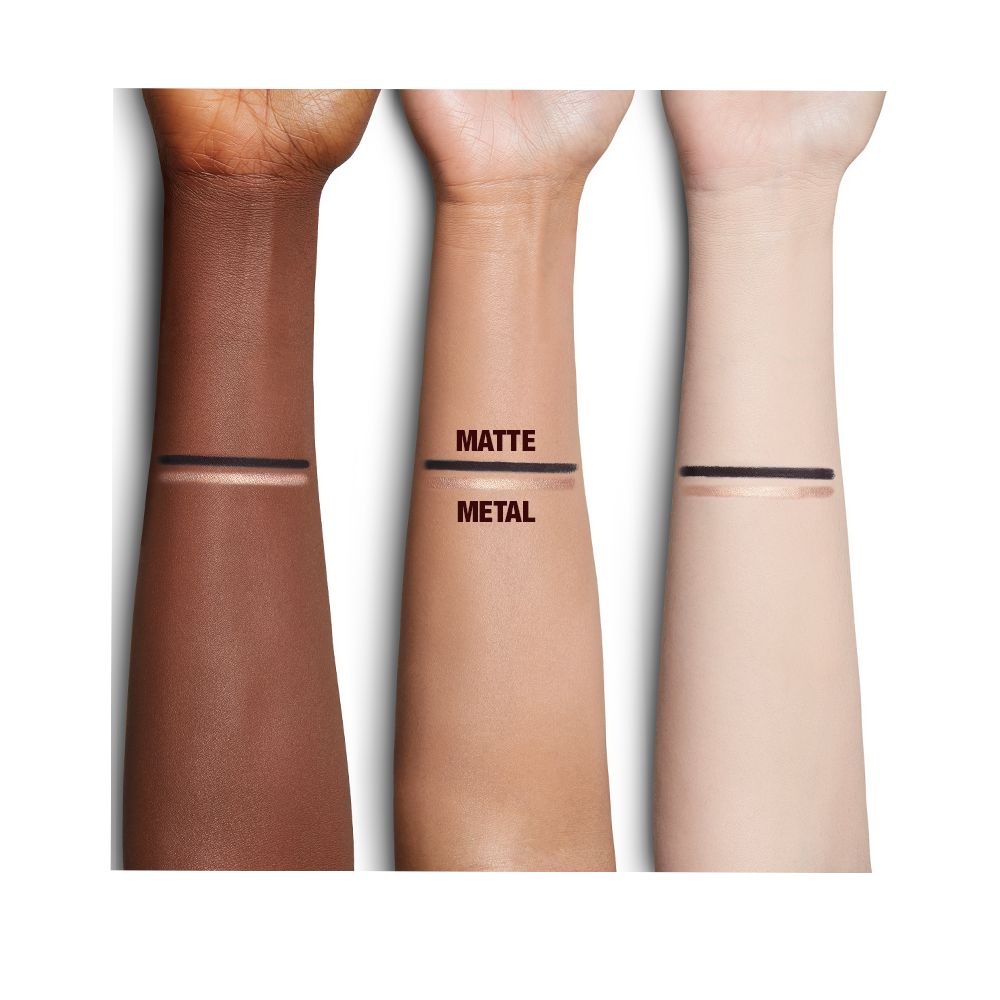 Fair, medium, and deep-tone arms with swatches of a duo eyeliner pencil in black and champagne-beige shades.