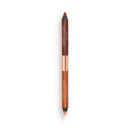 An open, double-ended eyeliner pen in warm rust and copper colours.