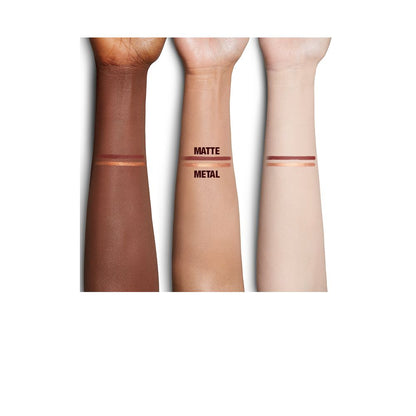 Arm swatches of copper and warm-rust eyeliners on fair, tan, and medium skin tones.