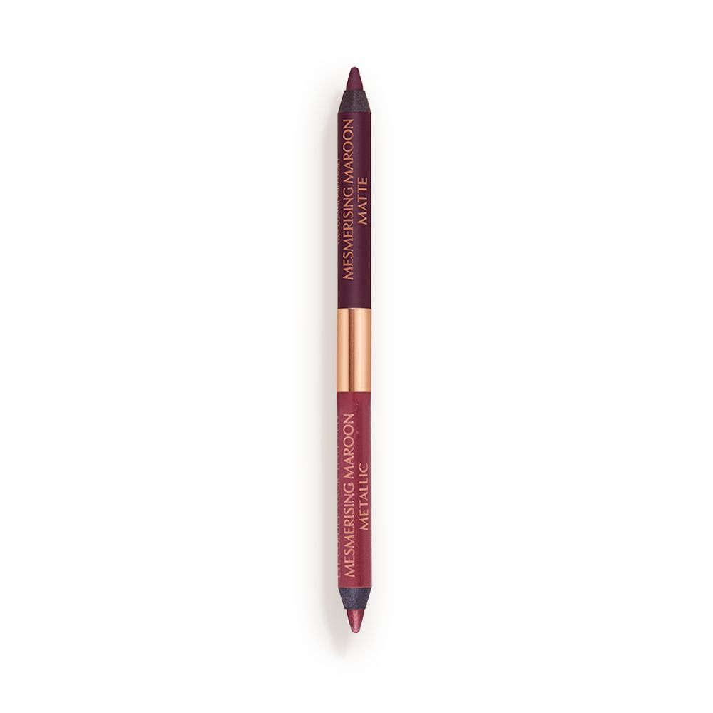 A double-ended eyeliner with lids removed with one side a bright maroon and the other a rich violet.