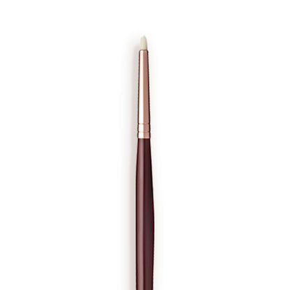 Close-up of an eyeliner brush with white-coloured brsitles with a rose-gold and dark crimson handle.