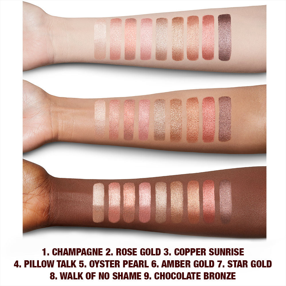 Fair, light, tan, and deep-tone arms with swatches of extremely pigmented cream eyeshadows with a metallic finish in shades of pink, gold, brown, peach, silver, purple, and bronze.