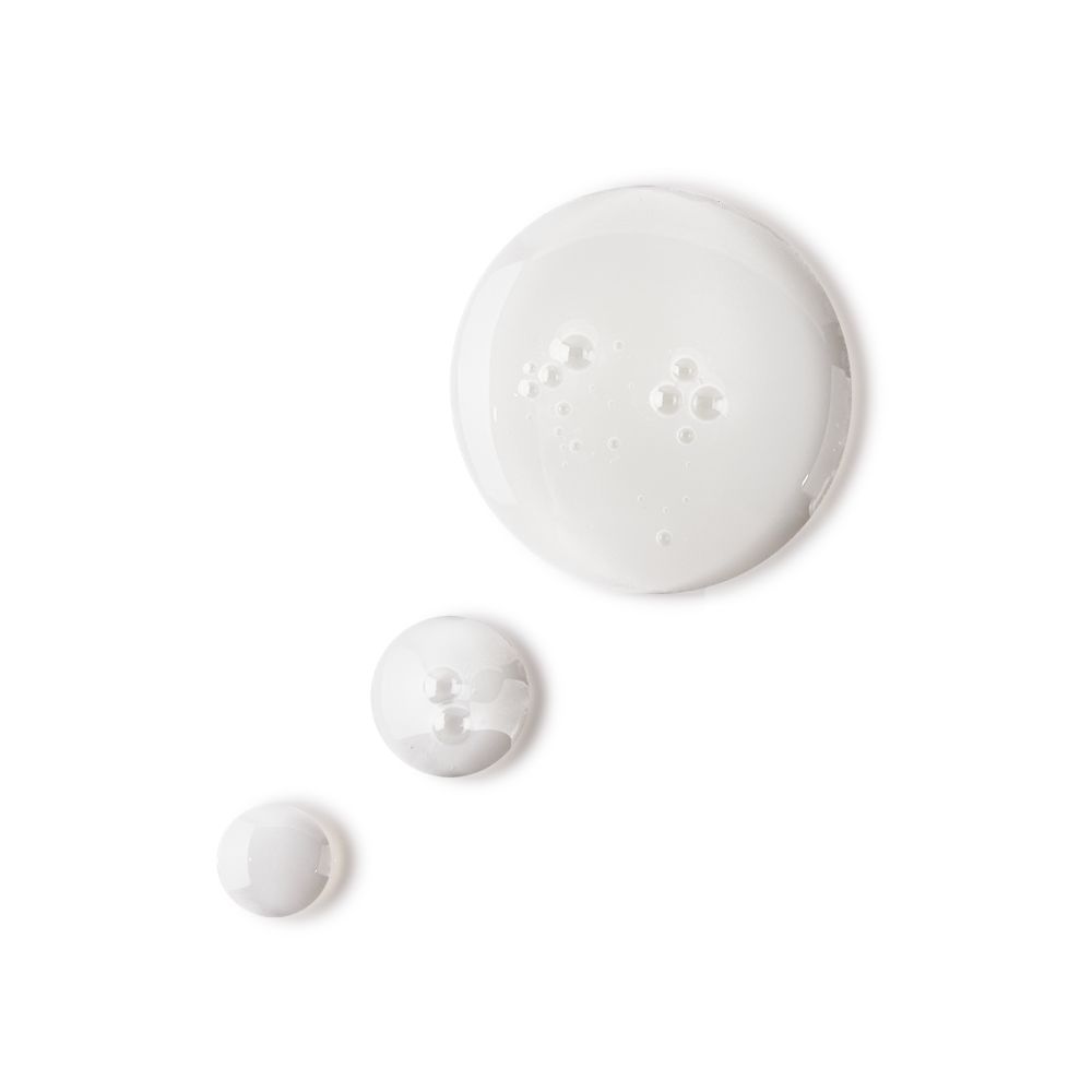 Pearly-white drops of a watery facial toner with a luminous finish.