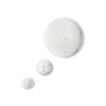 Pearly-white drops of a watery facial toner with a luminous finish.