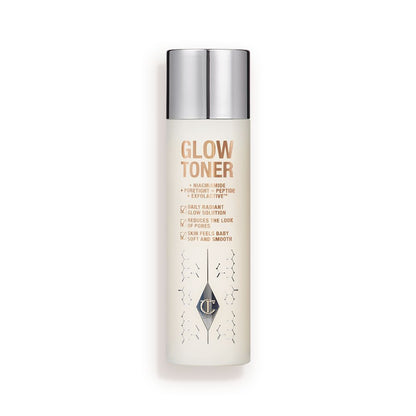 A large, clear bottle filled with luminous, cream-coloured watery toner with a silver-coloured lid.