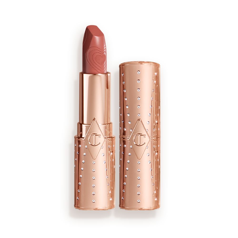 Two lipsticks, with and without lid, in a universally flattering peachy-nude shade with gold-coloured packaging.