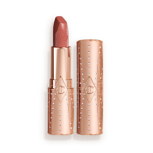 Two lipsticks, with and without lid, in a universally flattering peachy-nude shade with gold-coloured packaging.