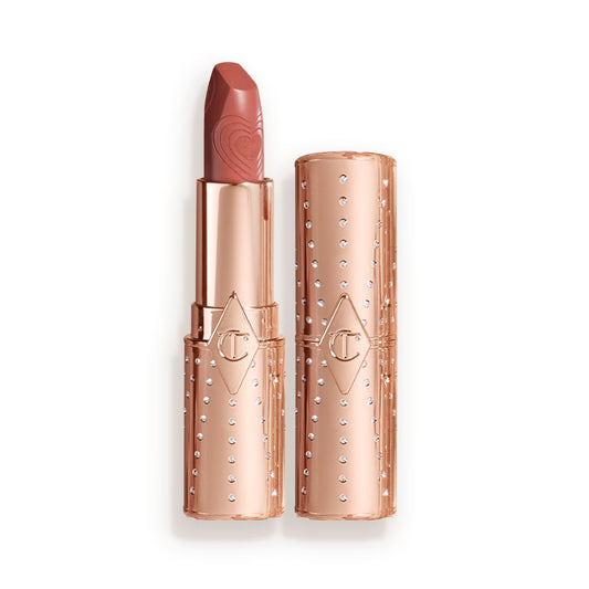 Two lipsticks, with and without lid, in a universally flattering peachy-nude shade with gold-coloured packaging.