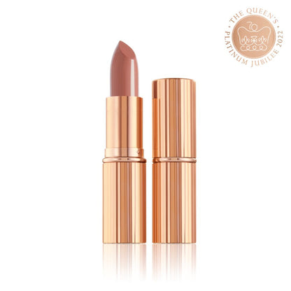 two lipsticks, with and without lid, in soft rosy peach shade with a satin finish in sleek gold-coloured packaging.