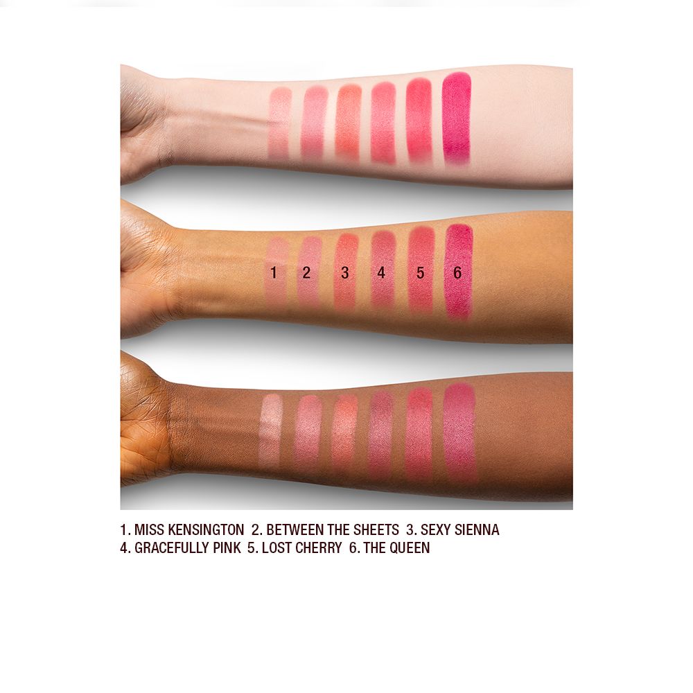 Light, tan, and deep-skin arm swatches of matte lipsticks in shades of light, warm, and dark pink.