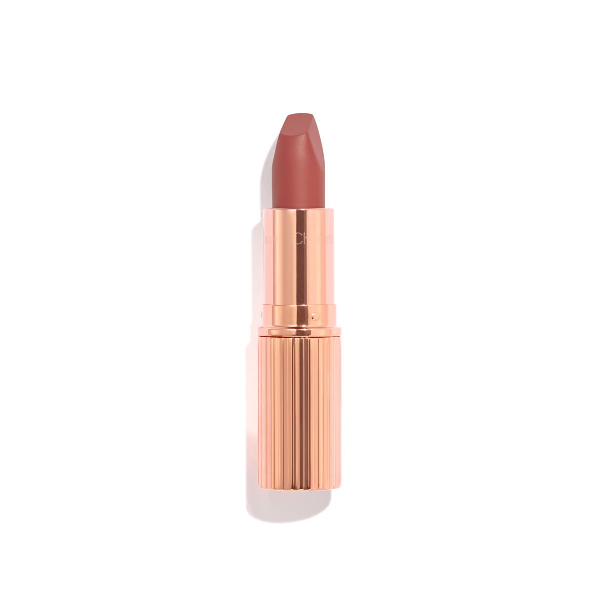 an open matte lipstick in a warm, berry-pink shade in a standard-sized, metallic, golden tube next to an unopened lipstick encased in a metallic, golden tube.