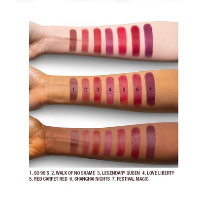Arm swatches on fair, medium, and dark tone models of matte lipsticks in shades of red, plum, and burgundy.