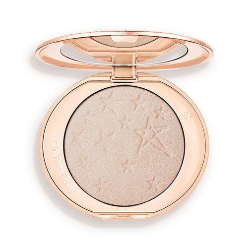 An open highlighter powder compact with a mirrored lid, in a shimmery silvery-opal shade.