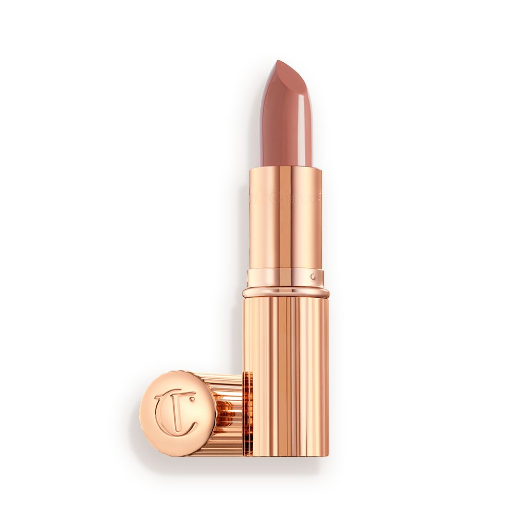 two lipsticks, with and without lid, in soft rosy peach shade with a satin finish in sleek gold-coloured packaging.