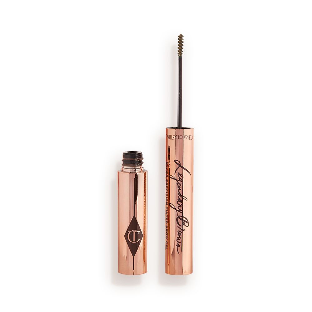 Open, tinted brow gel in a taupe shade with a thin brush for precision, and a shiny, gold-coloured tube.