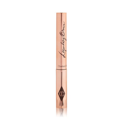 A closed tube of eyebrow gel in gold-coloured packaging.
